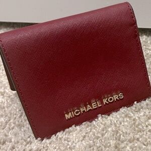Michael Kores stunning burgundy wallet. In pre owned condition